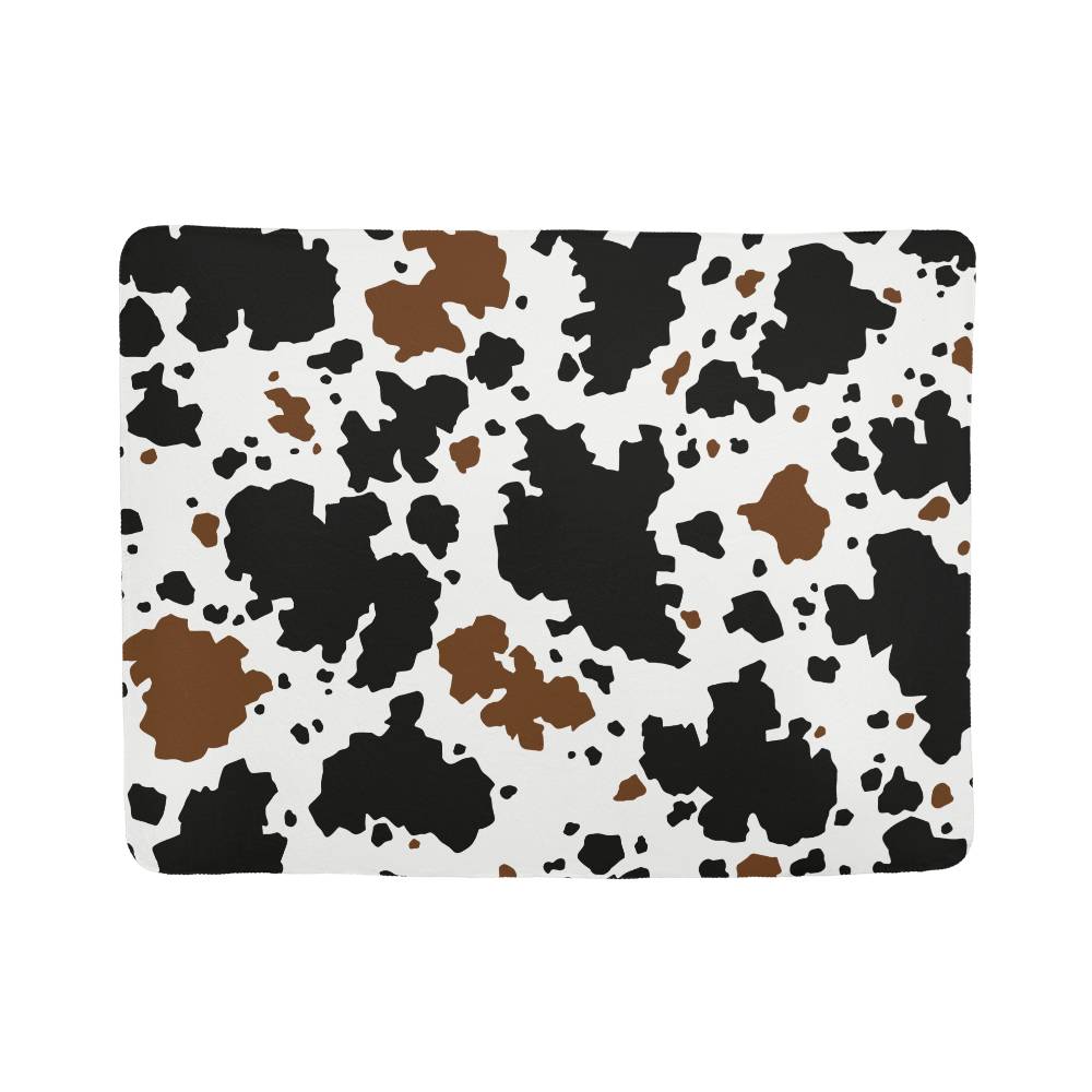 Stay Warm and Stylish with a Cow Print Blanket