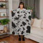 Stay Warm and Stylish with a Cow Print Blanket